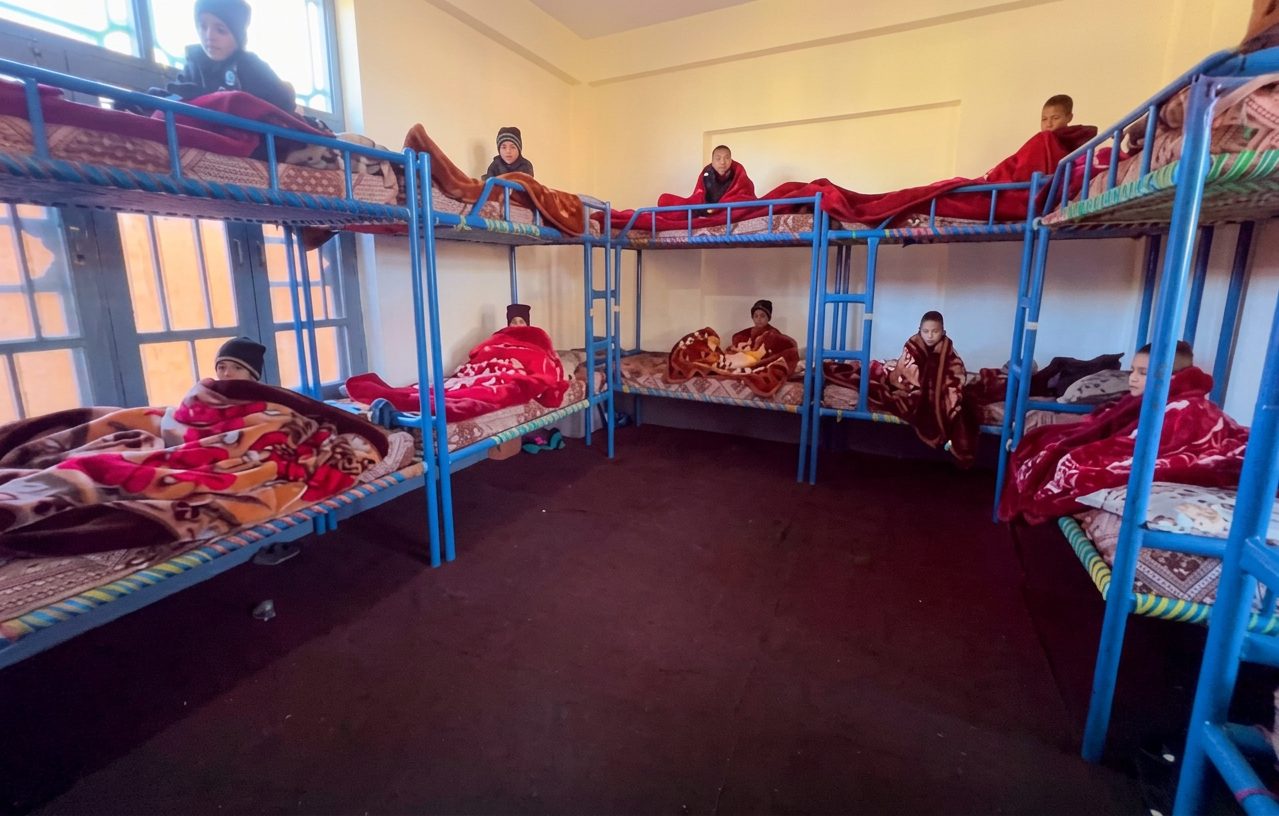 A room within the integrated housing facility at the Orphan School