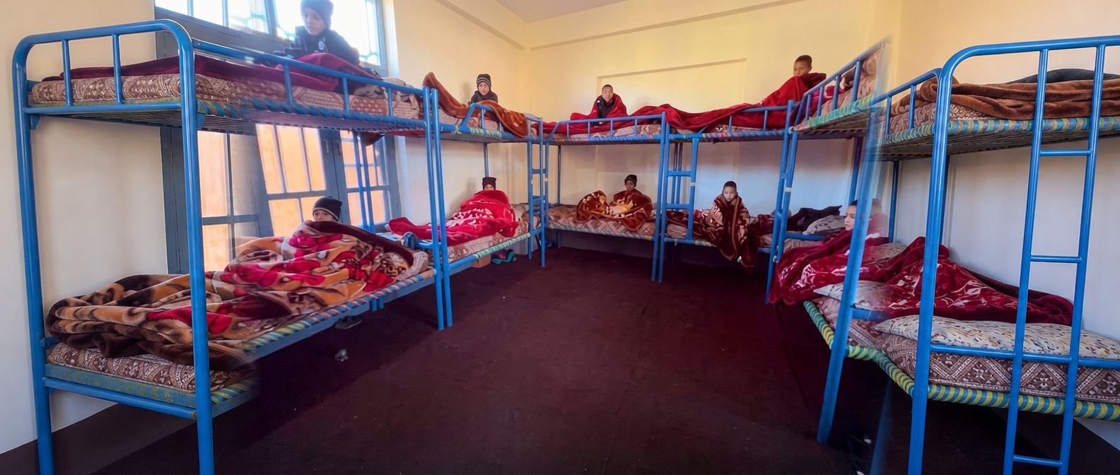 A room within the integrated housing facility at the Orphan School
