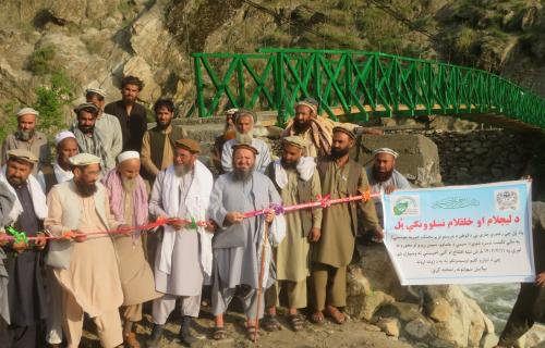 Construction of a bridge over the river for a village